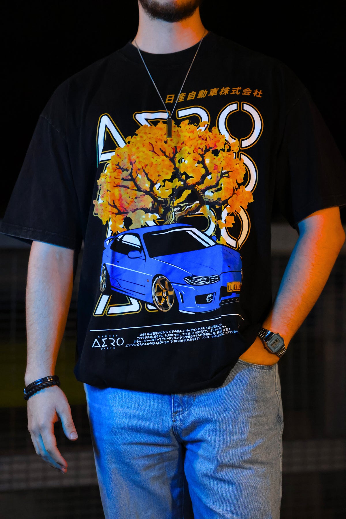 The UJELUS Tee, washed black oversized tee with blue S15 Silvia print (view 1)